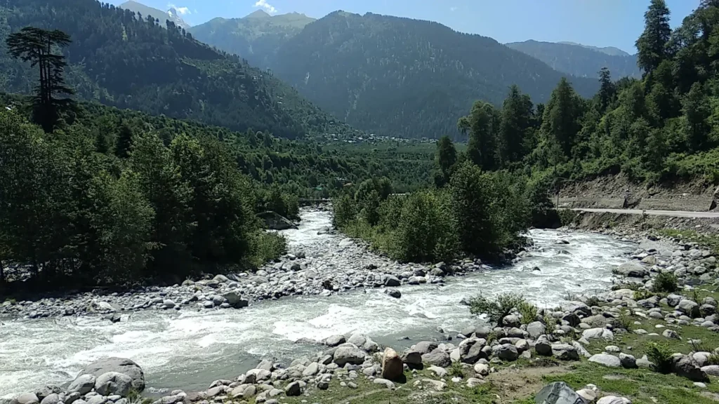 Rocky mountain river in Uttarakhand highlighting freshwater ecosystems, natural resources, and environmental conservation.